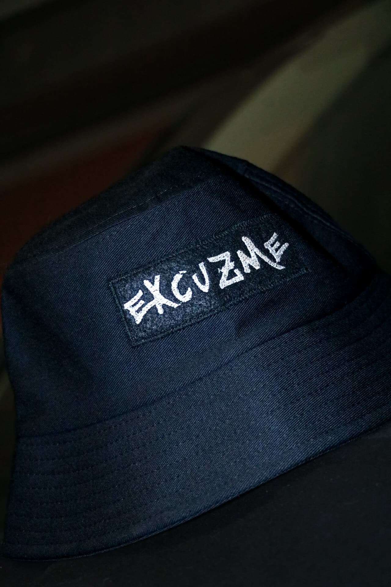 Detail shot of the embroidery on the bucket hat.